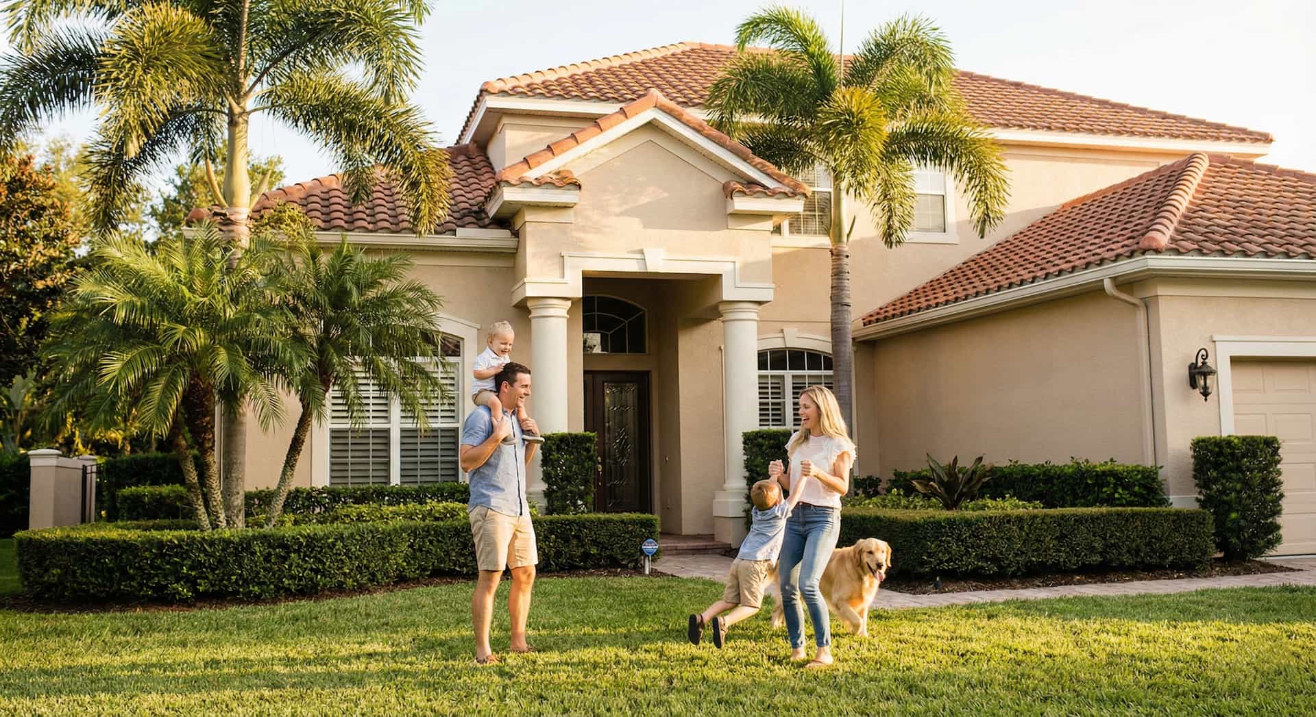 A young family playing in the front yard of their Florida home.